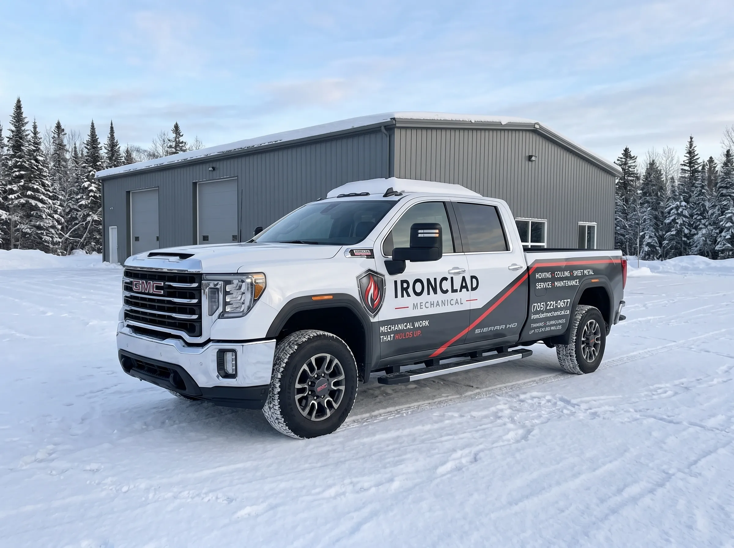 Ironclad Mechanical GMC service truck at a commercial site in Northern Ontario