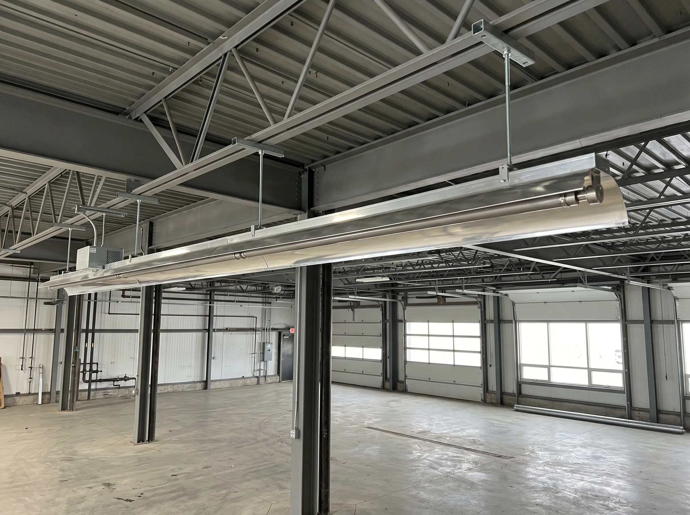 Commercial radiant tube heater installation in Northern Ontario industrial shop